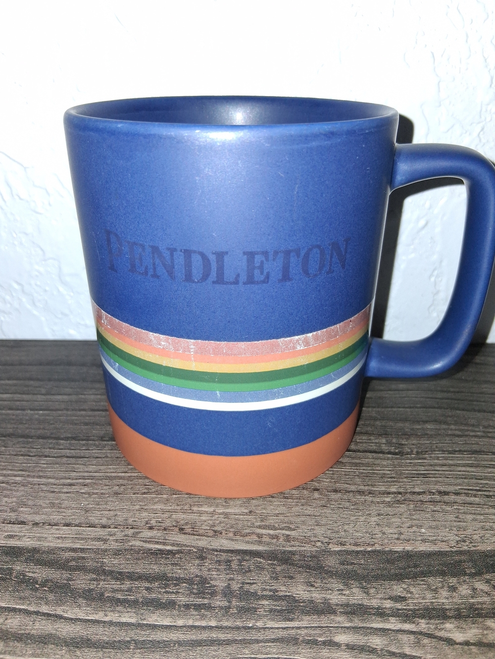 Pendleton Navy Blue Ceramic Mug with Multicolor Stripe and Tan Base